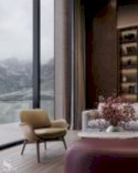 Poltrona Frau leather armchair in the relaxation zone overlooking the mountain lake