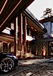 We used light brown wood, graphite black natural slate and metal to finish the house