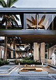 View of the inner courtyard with an open lounge area featuring a fireplace