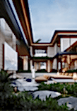 View of the inner courtyard with an open lounge area featuring a fireplace